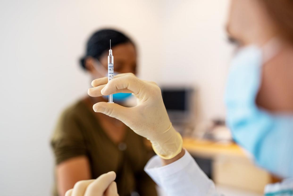 <span class="caption">Vaccines against COVID-19 are the safest – and fastest – way to prevent the spread of variants.</span> <span class="attribution"><a class="link " href="https://www.gettyimages.com/detail/photo/doctor-preparing-flu-or-coronavirus-injection-royalty-free-image/1278800490?adppopup=true" rel="nofollow noopener" target="_blank" data-ylk="slk:Luis Alvarez/ DigitalVision via Getty Images;elm:context_link;itc:0;sec:content-canvas">Luis Alvarez/ DigitalVision via Getty Images</a></span>