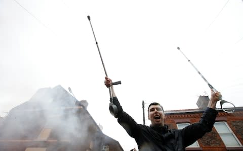 Liverpool fan with crutches outside the stadium before the match  - Credit: Action Images via Reuters/Carl Recine