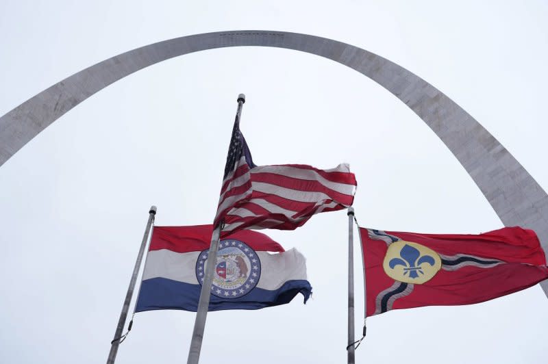 Strong winds whipped and damaged flags near the Gateway Arch in St. Louis as temperatures begin to fall there on Friday. Photo by Bill Greenblatt/UPI