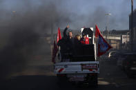 Protesters leave the Mediterranean port city in Marseille, southern France, after tensions Thursday, Dec.12, 2019. Unions have flatly rejected fresh proposals by the government of pro-business President Emmanuel Macron to stagger the roll-out of a plan that would require France's youngest workers - people born after 1974 - to stay on the job until the age of 64 to get full pensions instead of age 62. (AP Photo/Daniel Cole)