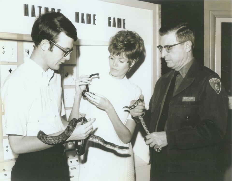 Bert Szabo is pictured with visitors and snakes at the F.A. Seiberling Nature Realm in this undated photo.