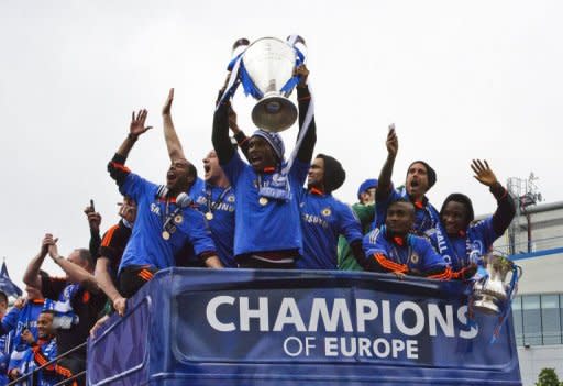 L-R: Members of the Chelsea squad, Ashley Cole, John Terry, Didier Drogba, Jose Bosingwa, Salomon Kalou, and Raul Meireles, celebrate with their trophy as they leave Stamford Bridge