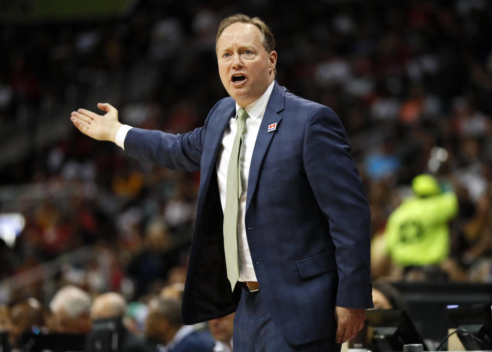 Atlanta Hawks head coach Mike Budenholzer reacts in the second half of an NBA basketball game against the Cleveland Cavaliers on Sunday, April 9, 2017, in Atlanta. The Hawks won in overtime 126-125. (AP Photo/Todd Kirkland)