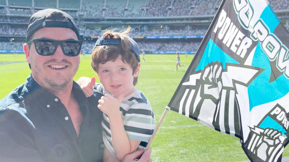 Seen here, former Port Adelaide player Tom Rockliff and his son at the Sunday AFL game at the MCG. 