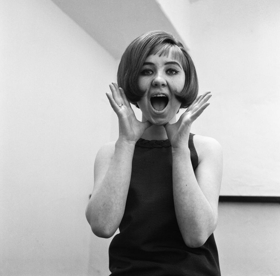 15 year old Lulu, (real name Marie Lawrie) from Glasgow who has made a debut disc entitled Shout with the Lovers. Pictured at Ristorante Pissala, Chancery Lane, London, WC2. 14th April 1964. (Photo by Doreen Spooner/Daily Mirror/Mirrorpix via Getty Images)