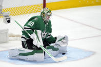 Dallas Stars goaltender Jake Oettinger blocks a St. Louis Blues shot during the second period of an NHL hockey game in Dallas, Wednesday, April 17, 2024. (AP Photo/Tony Gutierrez)