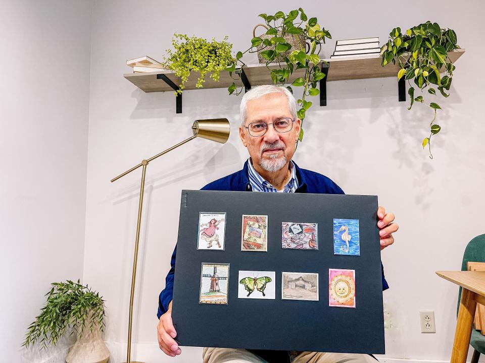 Artist Tim Wiegenstein with some of his artist trading card collection. “I am a teacher at heart, so I think that for me I need the interaction with other people,” he said. “It is a good thing to share your artwork and talk about your artwork.”