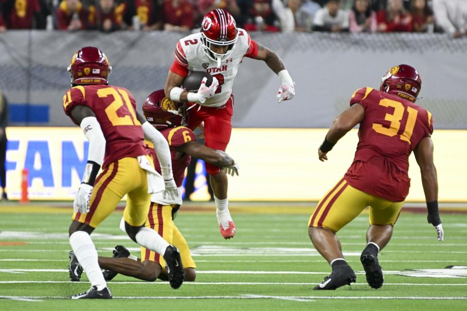 Utah running back Micah Bernard tries to evade a tackle by USC defensive back Mekhi Blackmon.