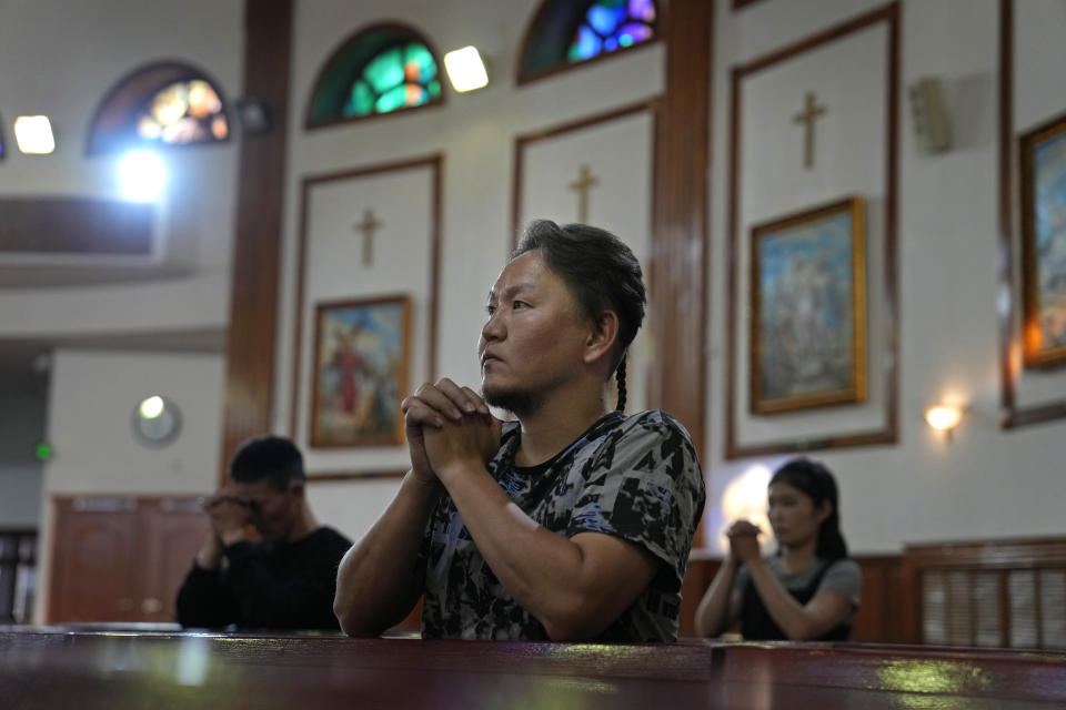 Mongolian faithfuls pray during a mass at the Saint Peter and Paul Cathedral in Ulaanbaatar, Mongolia on Monday, Aug. 28, 2023.When Pope Francis travels to Mongolia this week, he will in some ways be completing a mission begun by the 13th century Pope Innocent IV, who dispatched emissaries east to ascertain the intentions of the rapidly expanding Mongol Empire and beseech its leaders to halt the bloodshed and convert. (AP Photo/Ng Han Guan)