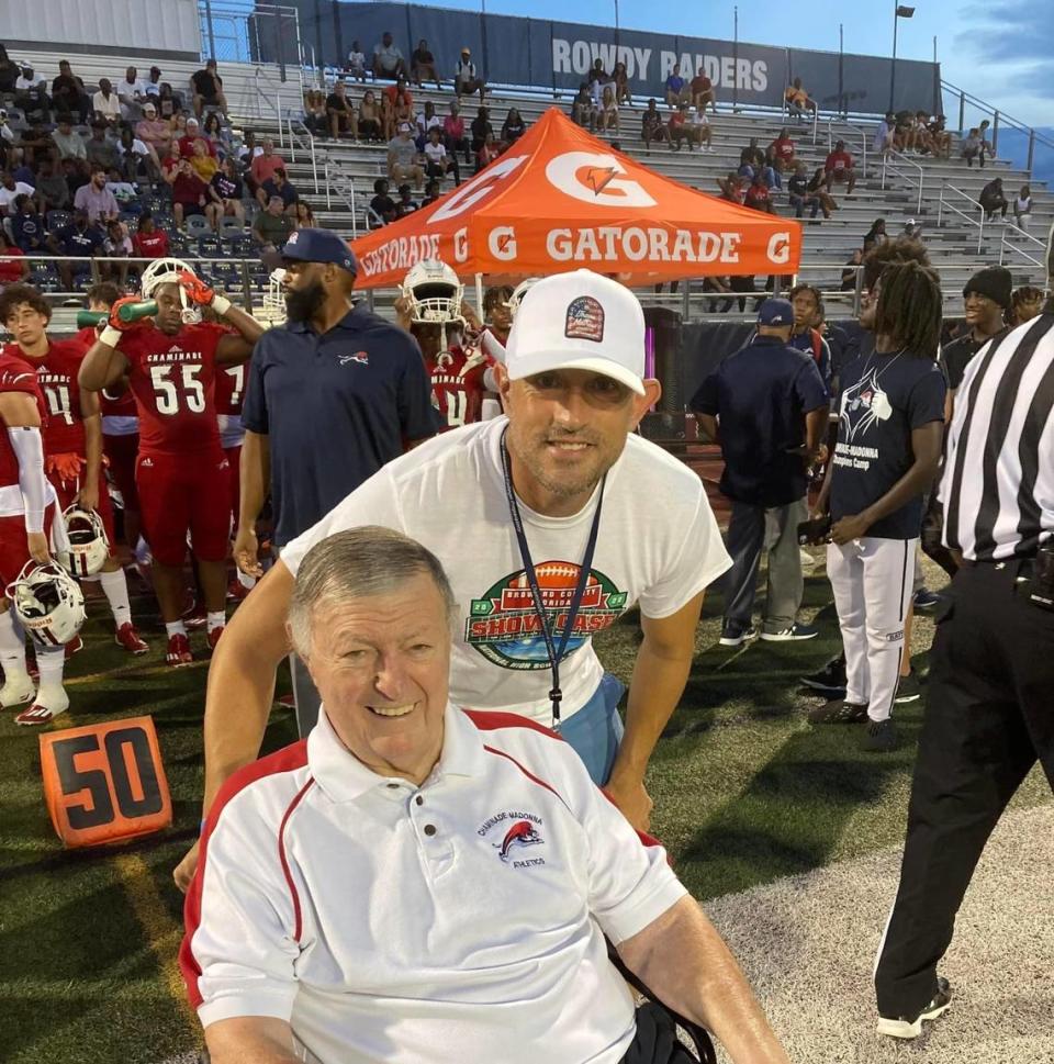 Former Chaminade football coach and athletic director Vince Zappone (bottom), seen here with the school’s current athletic director, Matt Bishop (top) on the sideline during a Lions’ football game in recent years, died this past week at age 93.