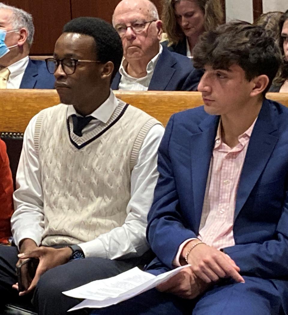 William Jjuunko, left, and Jordan Cohen, both from Framingham, discuss the need for a personal finance class for all Massachusetts students prior to graduation.