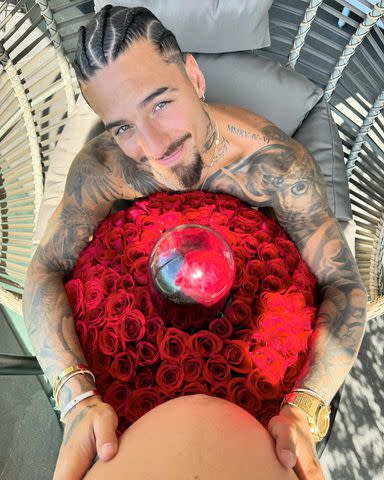 <p>Maluma/ Instagram</p> Maluma embraces girlfriend's stomach on Valentine's Day