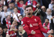 Liverpool's Andrew Robertson celebrates after scoring his sides first goal during the English Premier League soccer match between Liverpool and Everton at Anfield stadium in Liverpool, England, Sunday, April 24, 2022. (Peter Byrne/PA via AP)