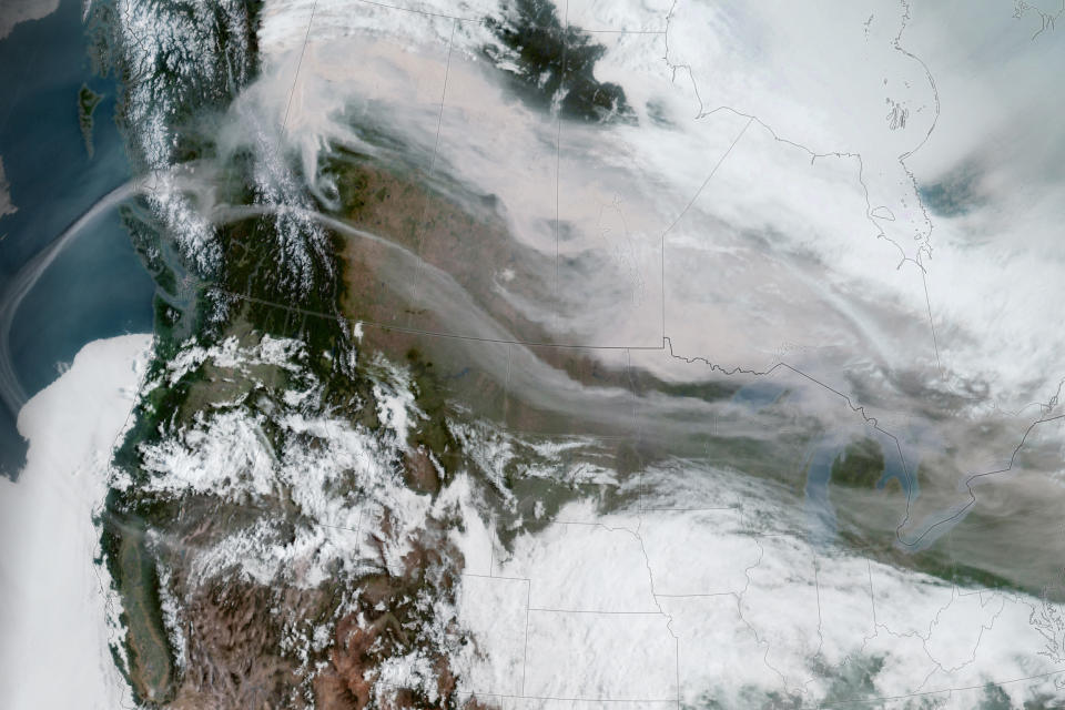 Smoke from the fires sweeps Monday over southern Canada, as well as North Dakota, Minnesota and several other states.  (NOAA)