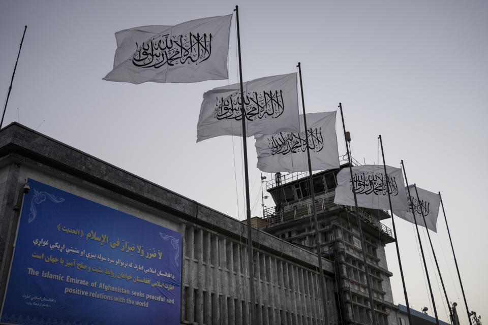 FILE - Taliban flags fly at the airport in Kabul, Afghanistan, on Sept. 9, 2021. The Taliban have waged a systematic assault on the freedom of Afghanistan's people, including women and girls experiencing “immeasurably cruel” oppression, the U.N.'s human rights chief said Tuesday, Sept. 12, 2023. (AP Photo/Bernat Armangue, File)