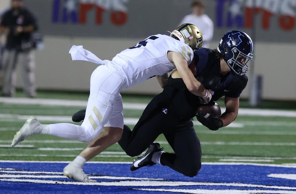 Regents defensive back Graham Reintjes tackles Argyle Liberty Christian's Aidan Grummer in the TAPPS Division II state championship game at Waco ISD Stadium on Friday.