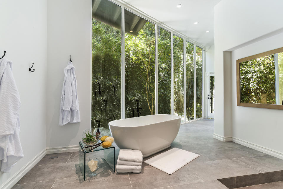 One of the bathrooms includes this minimalist tub. (Photo: Adam Latham)