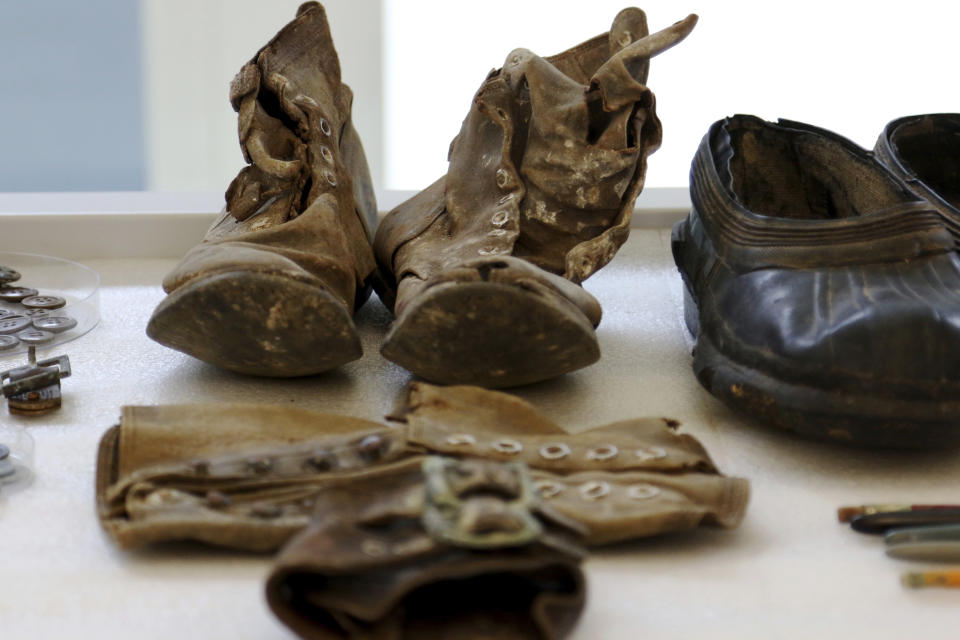 Artifacts from the Korean War are displayed at the U.S. Defense POW/MIA Accounting Agency Laboratory at Joint Base Pearl Harbor-Hickam, Hawaii on Tuesday, July 31, 2018. Human remains handed over to the U.S. government from North Korea are expected to arrive at the lab Wednesday where scientists will begin the process of trying to match the bones to American soldiers who didn't return from the Korean War. (AP Photo/Caleb Jones)