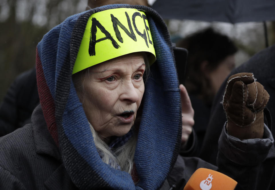 British fashion designer Vivienne Westwood speaks with the media as she attends a protest against the extradition of Wikileaks founder Julian Assange outside Belmarsh Magistrates Court in London, Monday, Feb. 24, 2020. The U.S. government and WikiLeaks founder Julian Assange will face off Monday in a high-security London courthouse, a decade after WikiLeaks infuriated American officials by publishing a trove of classified military documents. (AP Photo/Matt Dunham)