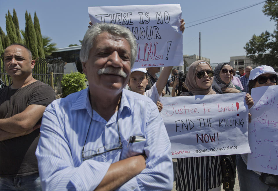 Palestinian protesters take part in a rally in front of the Prime Minister's office, in the West Bank city of Ramallah, Monday, Sept. 2. 2019. Palestinian women protested in front of the prime minister's office to demand an investigation into the death of Israa Ghrayeb, a 21-year-old woman whom many suspect was the victim of a so-called honor killing. (AP Photo/Nasser Nasser)