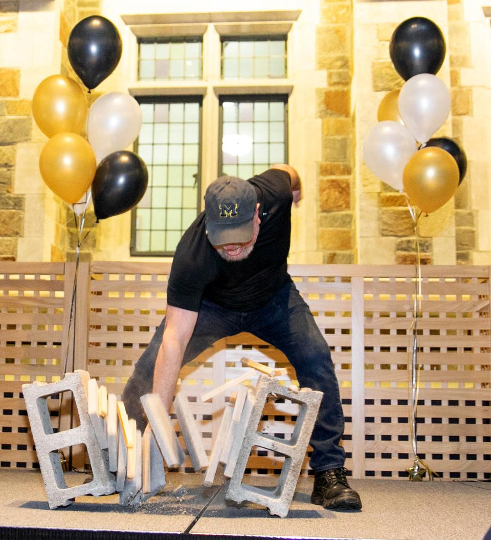 University of Michigan Law School professor Len Niehoff pummels five cement slabs at an annual charity event that helps support students who take public interest jobs during summer break. He is a third-degree black belt in a form of Tae Kwon Do known as Chung Do Kwan.