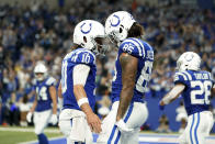 Indianapolis Colts tight end Drew Ogletree (85) celebrates his 33-yard touchdown reception withquarterback Gardner Minshew (10) during the second half of an NFL football game against the New Orleans Saints, Sunday, Oct. 29, 2023 in Indianapolis. (AP Photo/Michael Conroy)