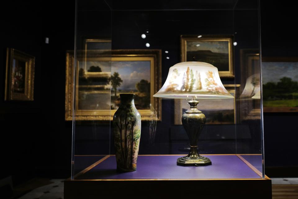 A vase and lamp on display at the u0022Re/Framing the View: Nineteenth-Century American Landscapesu0022 exhibit opening at the Whaling Museum in New Bedford.