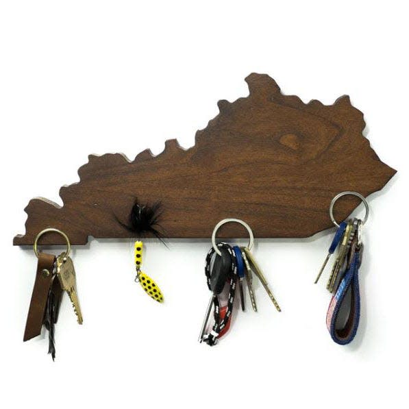 For the friend who is always losing their keys, may we suggest a magnetic key holder shaped like the Commonwealth? Veteran-made in Kentucky by Cruise Customs Flags, this American cherry hardwood wall décor is both functional and decorative.