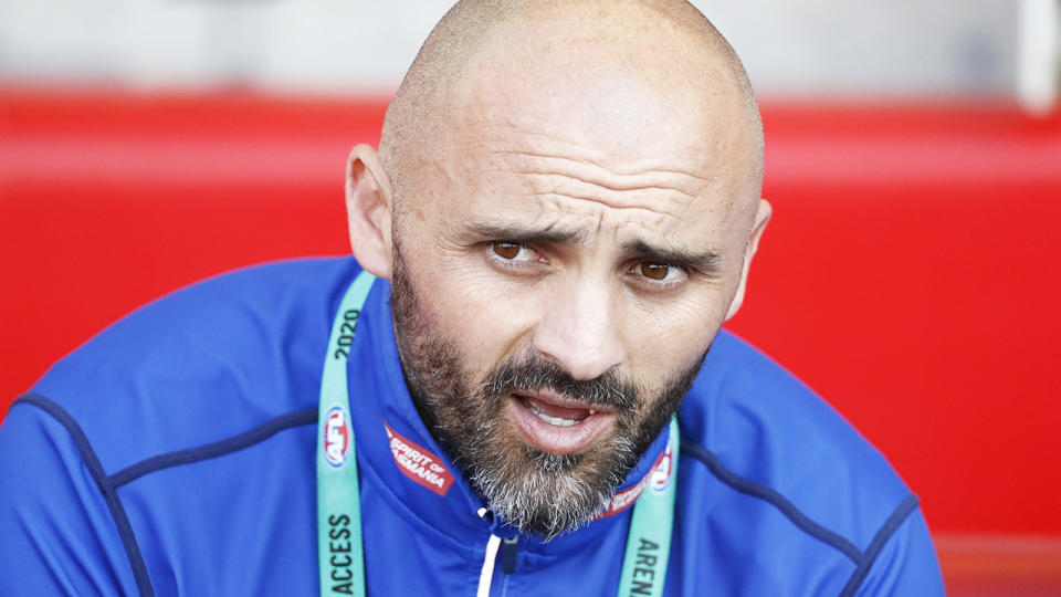 Rhyce Shaw is pictured coaching North Melbourne during a match in 2020.