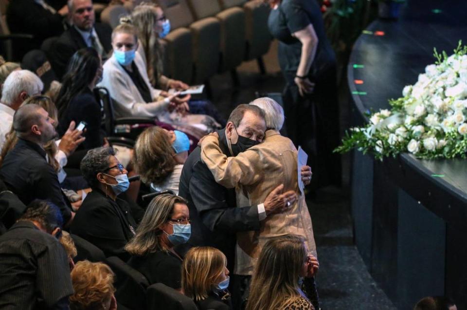 Dr. Jose A. Gonzalez is embraced during funeral services for his son, Edgar Gonzalez, at Christ Fellowship Church in Palmetto Bay on Friday, July 23, 2021. Edgar Gonzalez died during the collapse of the 12-story oceanfront condo, Champlain Towers South in Surfside.