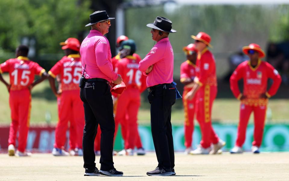 The umpires confer after Zimbabwe's controversial appeal