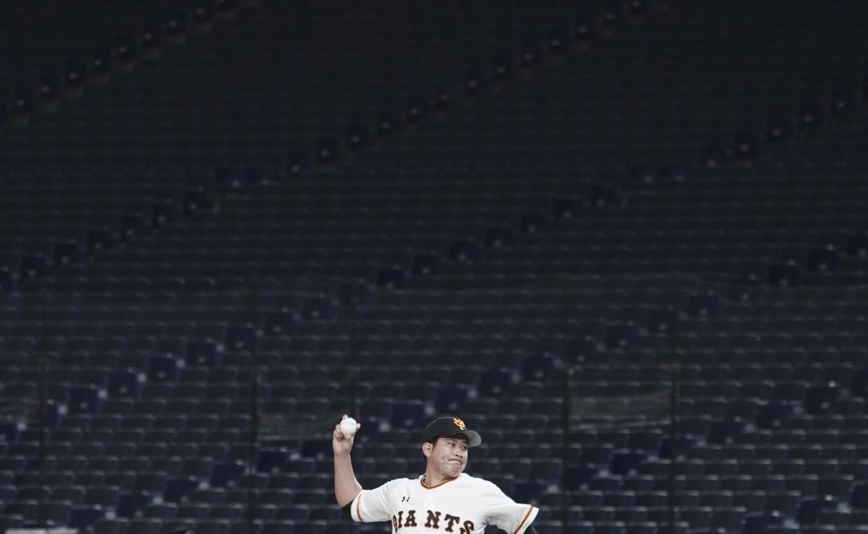 <span class="caption">Tomoyuki Sugano of the Yomiuri Giants pitches in front of empty stands at Tokyo Dome during a preseason baseball game.</span> <span class="attribution"><a class="link " href="http://www.apimages.com/metadata/Index/Virus-Outbreak-Empty-Spaces-Photo-Gallery/5bf7bde79e8247a1936e2165009bb9ea/6/0" rel="nofollow noopener" target="_blank" data-ylk="slk:AP Photo/Eugene Hoshiko;elm:context_link;itc:0;sec:content-canvas">AP Photo/Eugene Hoshiko</a></span>