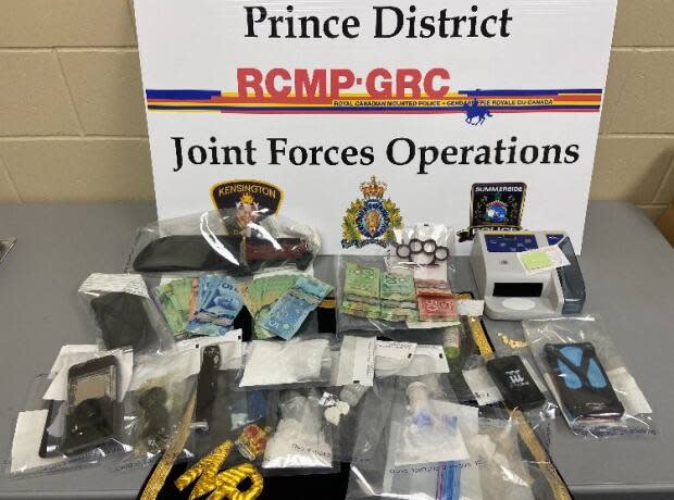 Drugs, cash and weapons seized by police in Summerside Thursday. (RCMP - image credit)