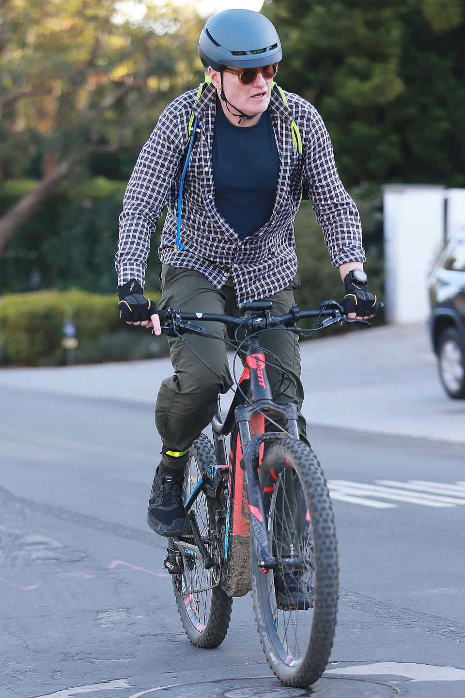 <p>Conan O'Brien rides his bike in his Los Angeles neighborhood on Saturday.</p>