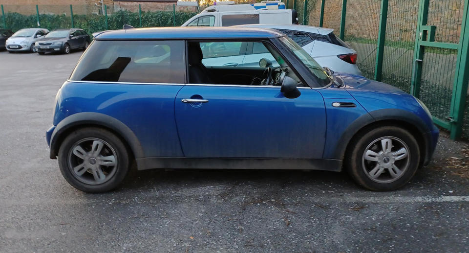 A blue Mini is pictured parked in Nottingham, England.