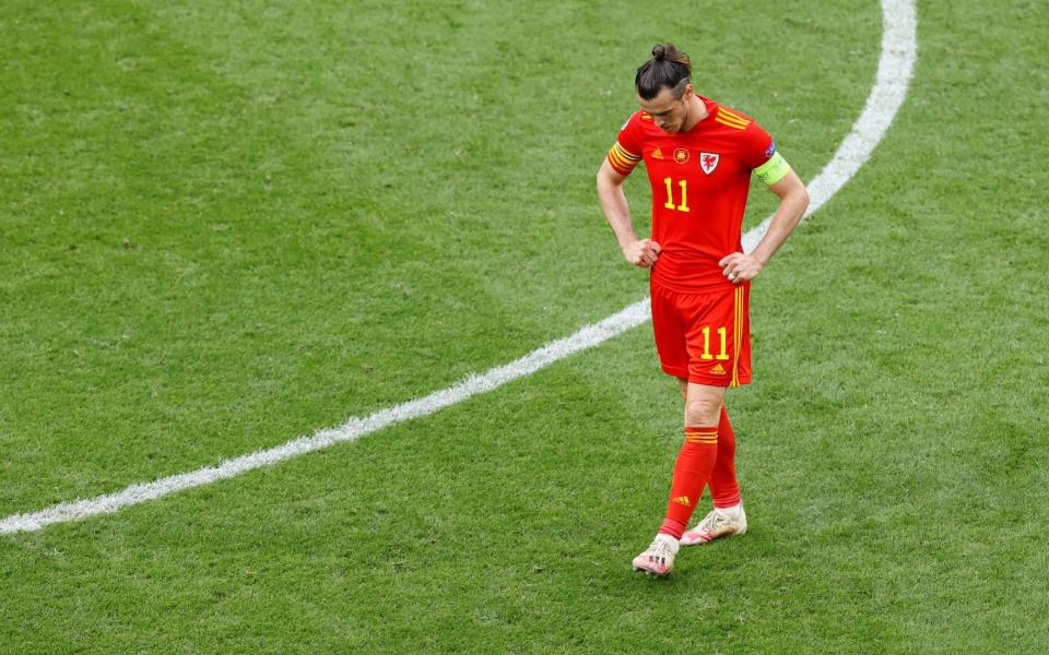 Gareth Bale trudges off the pitch after Wales' defeat to Denmark - REUTERS