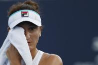 Mar 21, 2019; Miami Gardens, FL, USA; Irina-Camelia Begu of Romania wipes her face with a towel between points against Bianca Andreescu of Canada (not pictured) in the first round of the Miami Open at Miami Open Tennis Complex. Mandatory Credit: Geoff Burke-USA TODAY Sports