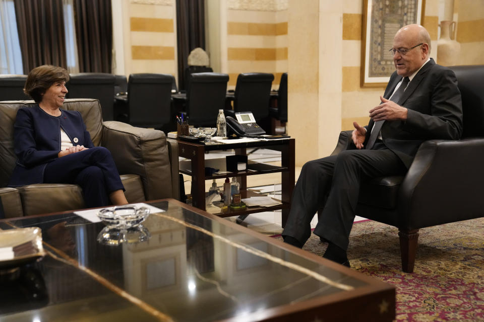 French Foreign Minister Catherine Colonna, left, meets with Lebanese caretaker Prime Minister Najib Mikati, right, at the government palace in Beirut, Lebanon, Monday, Dec. 18, 2023. (AP Photo/Hussein Malla)