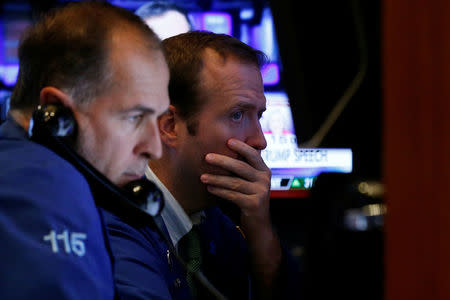 Traders work on the floor of the New York Stock Exchange (NYSE) in New York City, U.S., October 24, 2016. REUTERS/Brendan McDermid