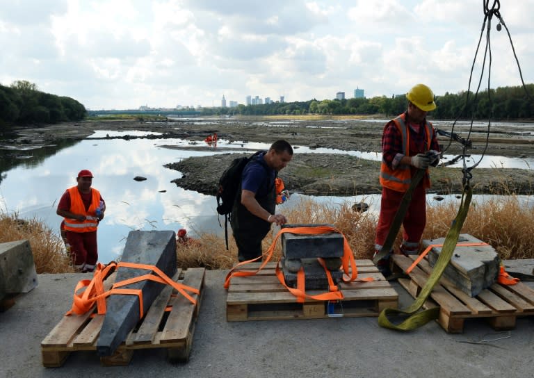 Historians recover 17th century relics from the Vistula river in Warsaw on September 3, 2015, after drought lowered the level of the river