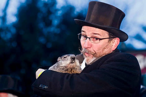 Groundhog handler Ben Hughes carries Phil at the 2010 Groundhog Day event in Punxsutawney, PA.