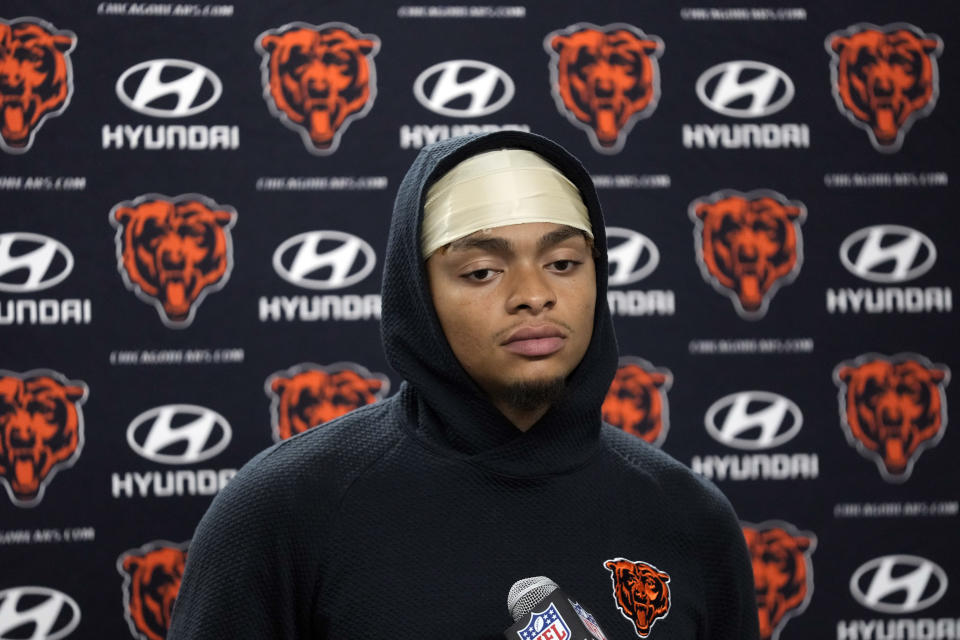 Chicago Bears quarterback Justin Fields addresses the media after an NFL football game against the Detroit Lions, Sunday, Nov. 19, 2023, in Detroit. (AP Photo/Paul Sancya)
