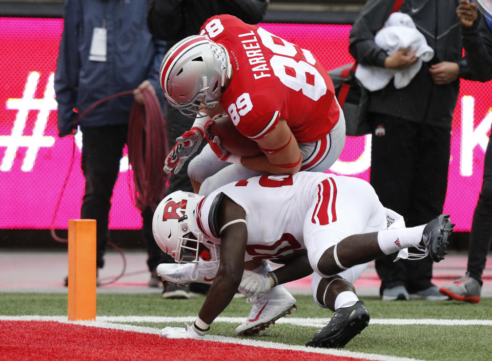 Ohio State tight end Luke Farrell, (89) scores a touchdown past Rutgers defensive back Avery Young during the first half of an NCAA college football game Saturday, Sept. 8, 2018, in Columbus, Ohio. (AP Photo/Jay LaPrete)