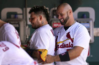 St. Louis Cardinals' Yadier Molina, left, gets a hug from teammate Albert Pujols after hitting his second home run of a baseball game against the Washington Nationals during the fourth inning Thursday, Sept. 8, 2022, in St. Louis. Molina also homered in the second. (AP Photo/Jeff Roberson)