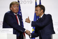 FILE - In this Aug. 26, 2019, file photo, French President Emmanuel Macron and U.S President Donald Trump shake hands during the final press conference during the G7 summit in Biarritz, southwestern France. With a year to go to the presidential vote, French President Emmanuel Macron is getting ready for a potential re-election bid by prioritizing reviving the economy and saving jobs. The country is slowly stepping out of its partial lockdown. Macron’s ability to meet the challenge will be key _ as France is among countries worst hit by the pandemic in the world, with over 105,000 virus-related deaths. (AP Photo/Francois Mori, File)