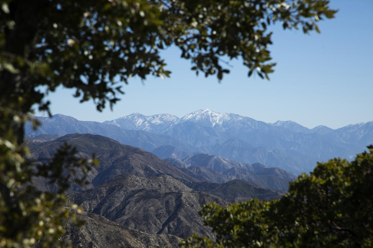 Snow-covered Mt. Baldy is visible from Mt. Disappointment Road in the San Gabriel Mountains. Multiple peaks can be hiked from Eaton Saddle, but currently the entrance to Mt. Wilson Red Box Road is closed to vehicle traffic requiring a 2.3 mile hike to the saddle trailhead. Alternatively, Mt. Disappointment Road and Bill Reily Trail can be used to hike in. Photographed on Thursday, Feb. 18, 2021 in Altadena, CA. (Myung J. Chun / Los Angeles Times via Getty Images file)