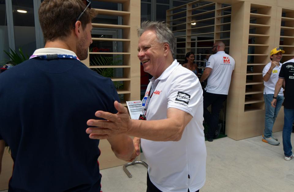 Gene Haas, owner of the Haas F1 Racing team, right, greets former Haas F1 driver Romain Grosjean in the paddock area at the Formula 1 Crypto.com Miami Grand Prix, Saturday, May 7, 2022 in Miami Gardens.