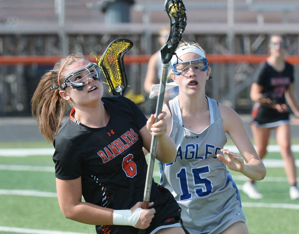 Cathedral Prep sophomore Sophia Glance, left, competes with Conneaut Area High School sophomore Victoria Medrick during a PIAA District 10 girls lacrosse championship at Dollinger Field, Hagerty Family Events Center, in Erie on May 31, 2023.