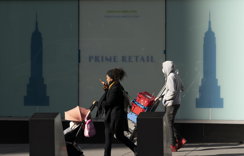 Empty retail space is available for lease in the Empire State Building, Thursday, Dec. 10, 2020, in New York. The spread of COVID-19 vaccines will power a stronger global economic recovery in 2021, the International Monetary Fund forecast Tuesday, Jan. 26, 2021. (AP Photo/Mark Lennihan)