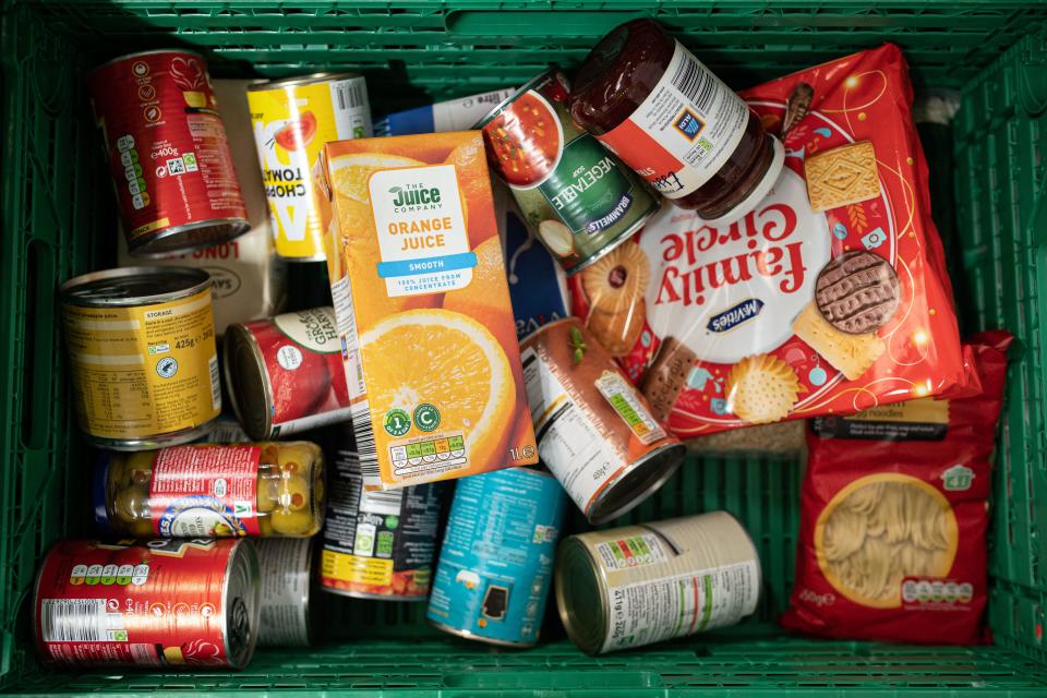 A tray containing half the items that constitutes a 'family food parcel', intended to feed a family of four for three days, is stacked at The Halo Centre, the central distribution point for donated items to be distributed to the Coventry Foodbank network of 14 sites across the city, in Coventry, central England on January 23, 2023. - In Coventry, a city once home to a thriving car manufacturing industry, the 